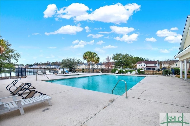 view of swimming pool with a patio