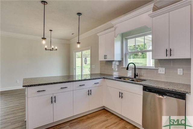 kitchen with dishwasher, pendant lighting, white cabinetry, and sink