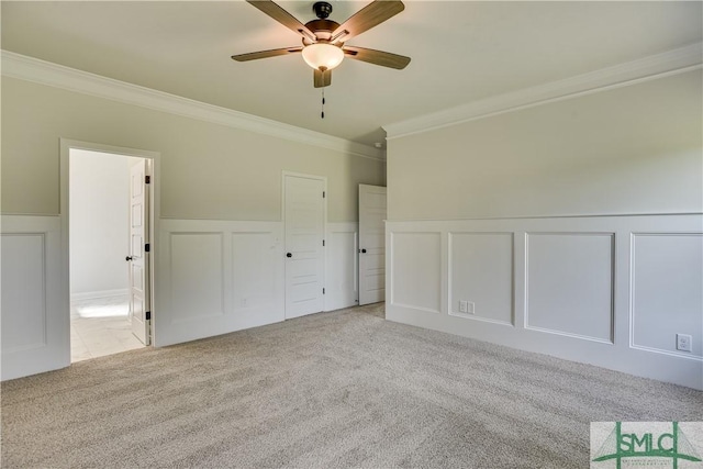 interior space featuring ceiling fan and crown molding