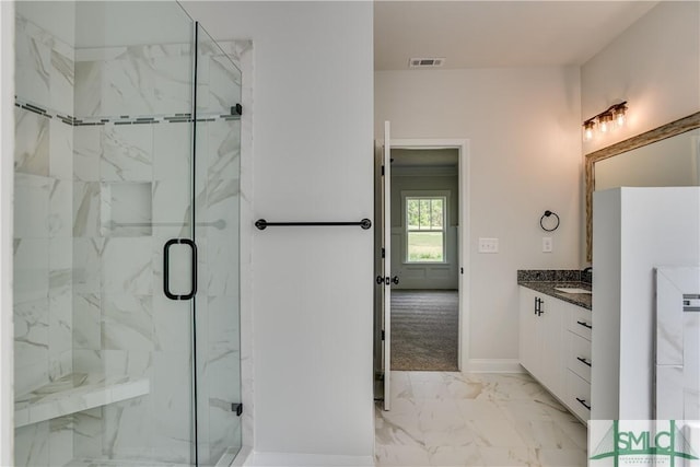 bathroom with vanity and an enclosed shower