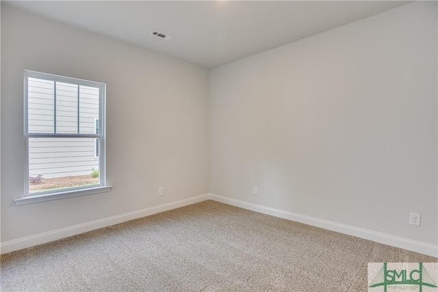 empty room featuring carpet floors