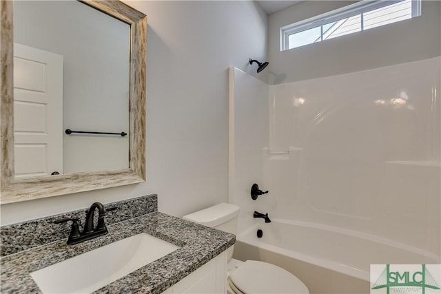 full bathroom with vanity, shower / bath combination, and toilet