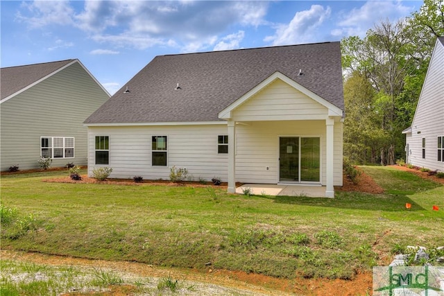 rear view of property with a patio area and a yard