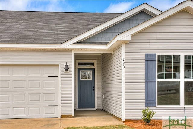 entrance to property featuring a garage