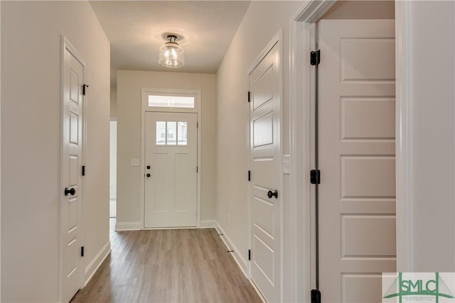 doorway with light hardwood / wood-style flooring