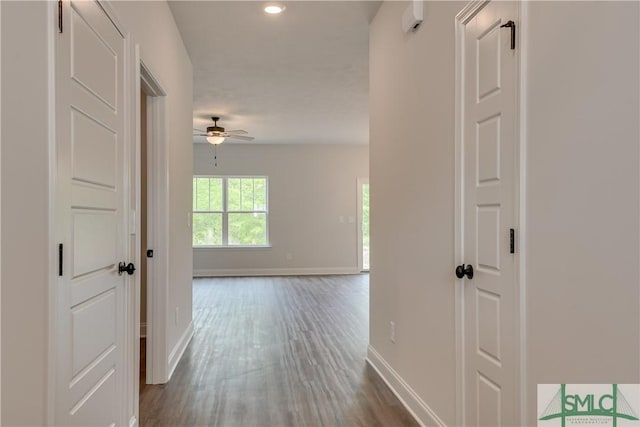 hall with dark hardwood / wood-style flooring