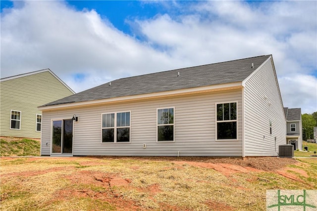 rear view of house with central AC unit