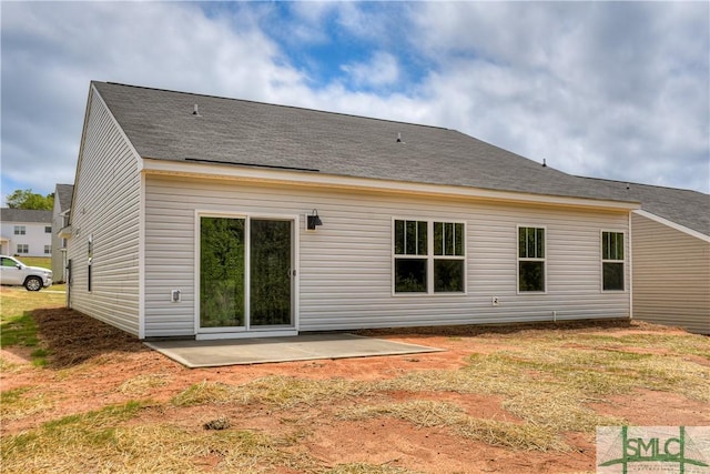 back of property with a patio