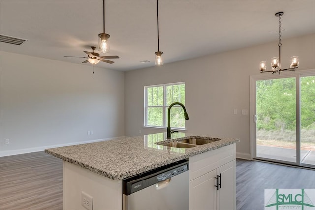 kitchen featuring stainless steel dishwasher, sink, a center island with sink, white cabinets, and hardwood / wood-style floors