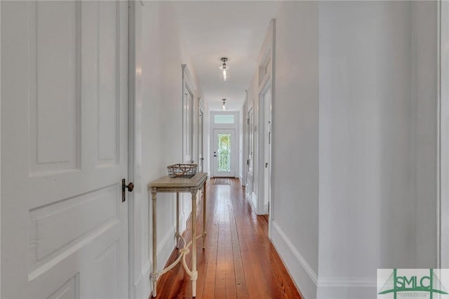 corridor featuring hardwood / wood-style flooring