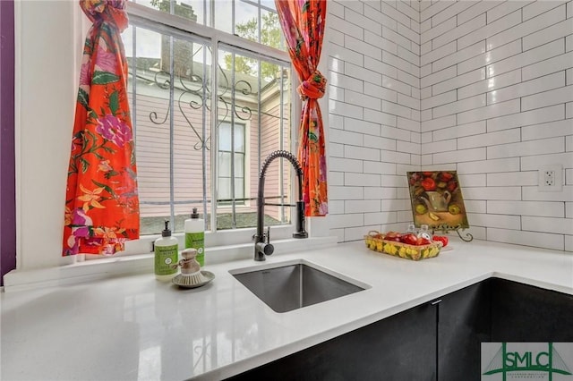 kitchen with a wealth of natural light and sink