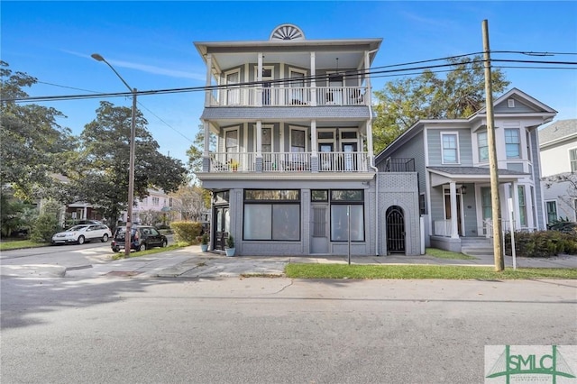 view of front of house featuring a balcony