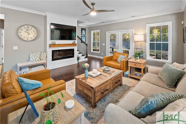 living room featuring ceiling fan, french doors, crown molding, and light hardwood / wood-style flooring