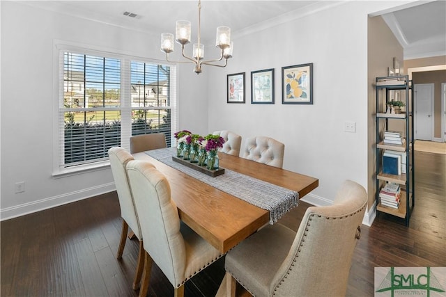 dining area with a notable chandelier, dark hardwood / wood-style flooring, and ornamental molding