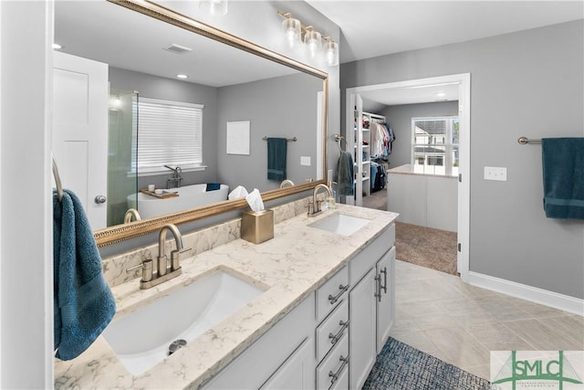 bathroom featuring tile patterned floors and vanity