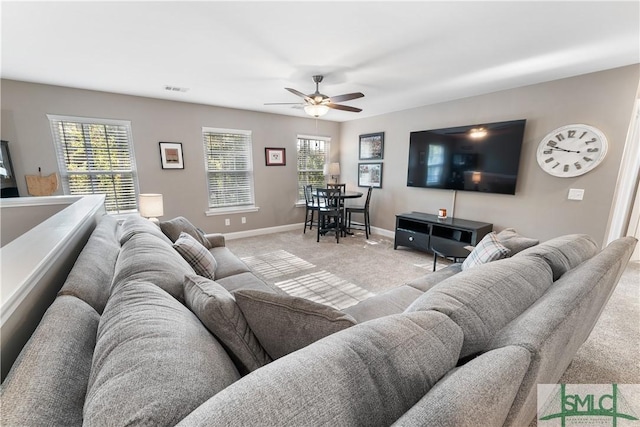 living room with ceiling fan and light carpet