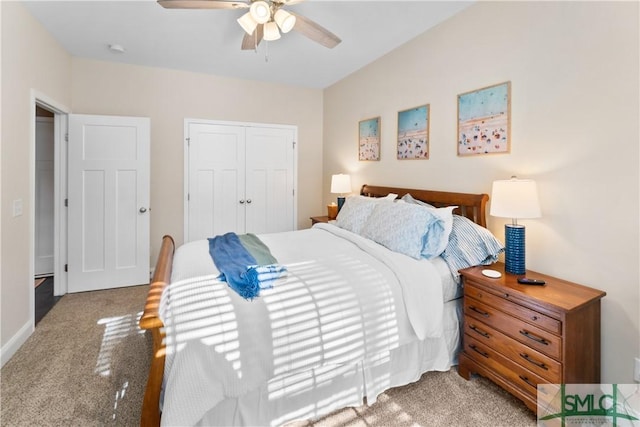 bedroom featuring a closet, light colored carpet, and ceiling fan