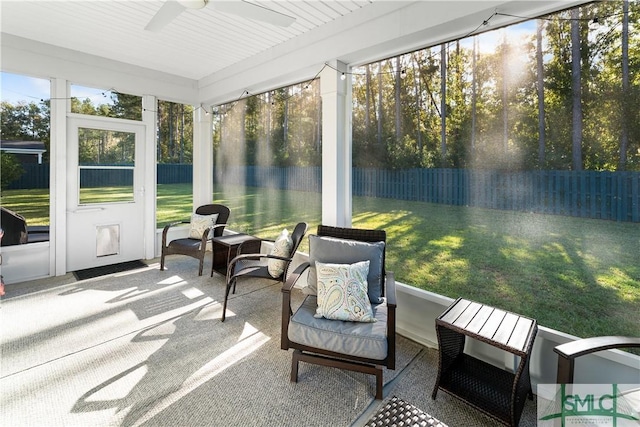 sunroom featuring ceiling fan