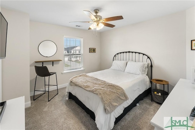 bedroom featuring ceiling fan and carpet