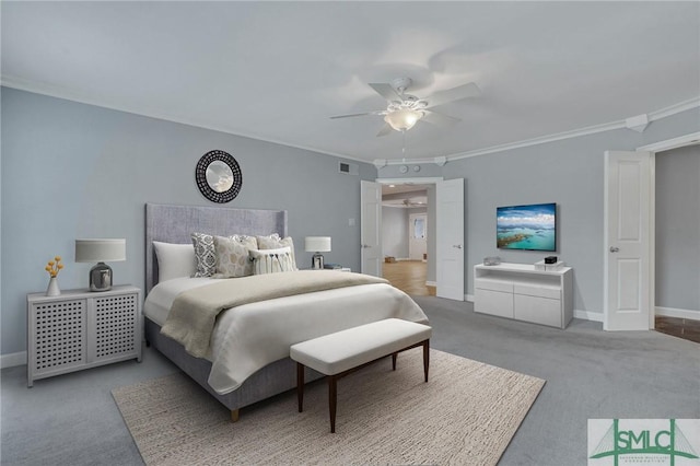 bedroom featuring carpet flooring, ceiling fan, and ornamental molding