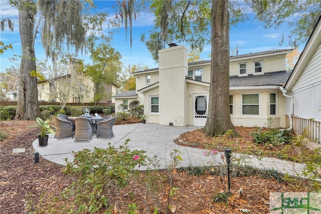 rear view of property with a patio area