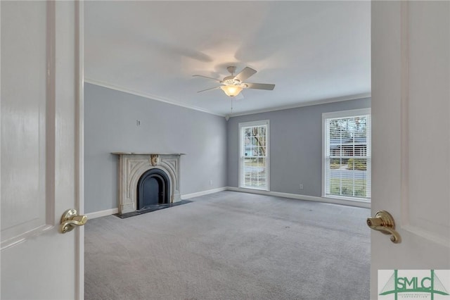 unfurnished living room featuring light carpet, ceiling fan, and crown molding