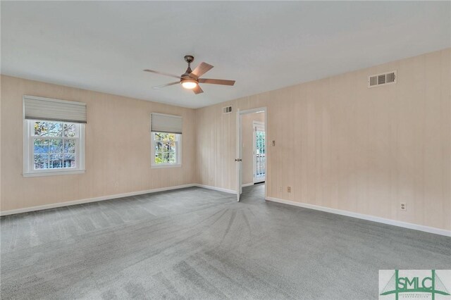 unfurnished room featuring carpet and ceiling fan