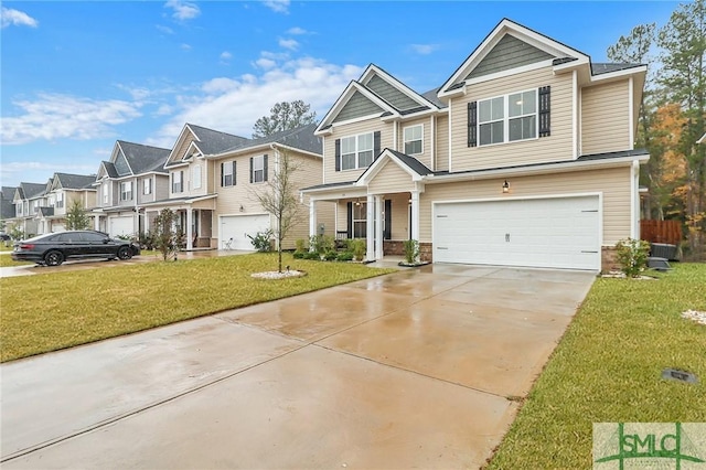 view of front of home featuring a front yard and a garage