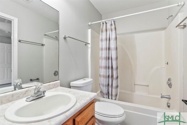 full bathroom featuring vanity, shower / tub combo, a textured ceiling, and toilet