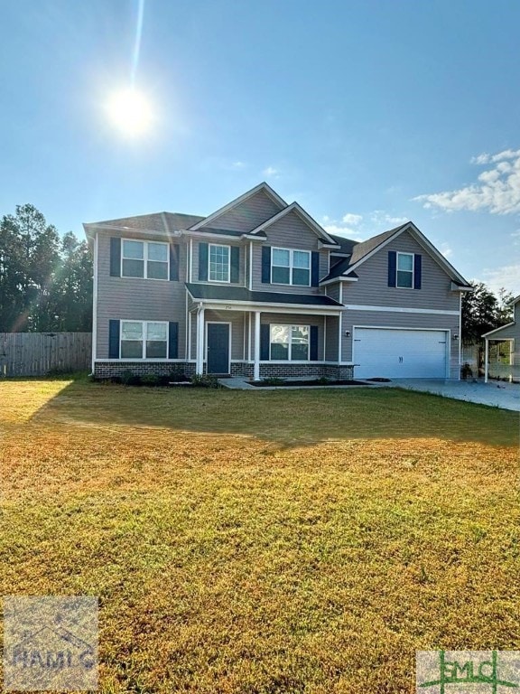 view of front of property featuring a front yard and a garage