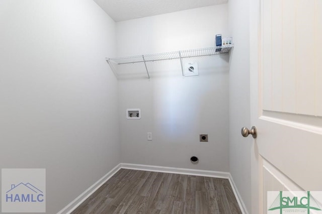 clothes washing area with hookup for a washing machine, dark hardwood / wood-style flooring, and electric dryer hookup