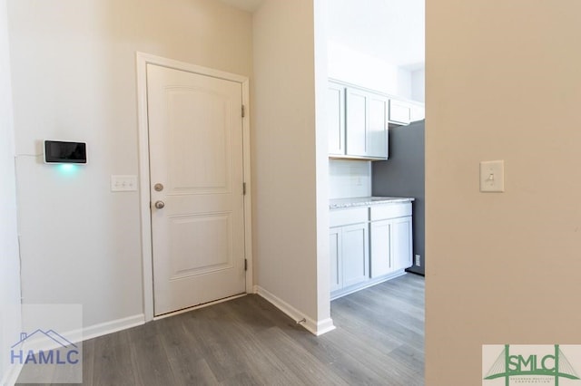 hallway featuring dark wood-type flooring