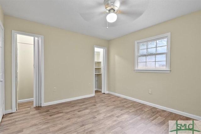 unfurnished bedroom featuring ceiling fan and light hardwood / wood-style floors