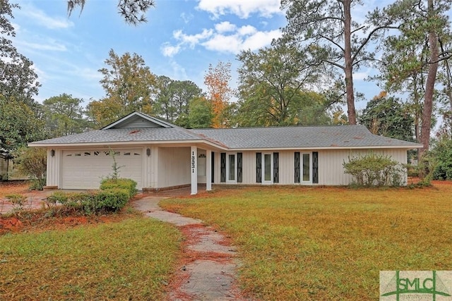 single story home with a front lawn and a garage