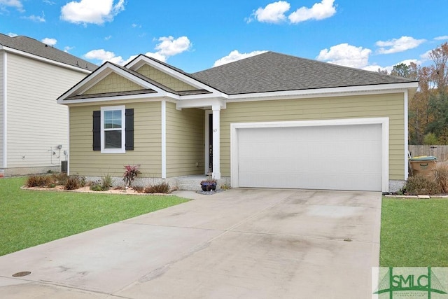 view of front facade featuring a garage and a front lawn