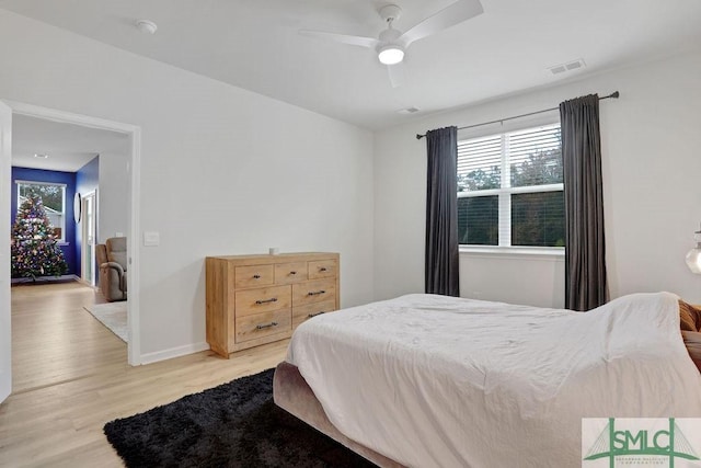 bedroom featuring ceiling fan and light hardwood / wood-style floors