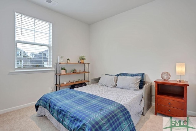 bedroom with light colored carpet