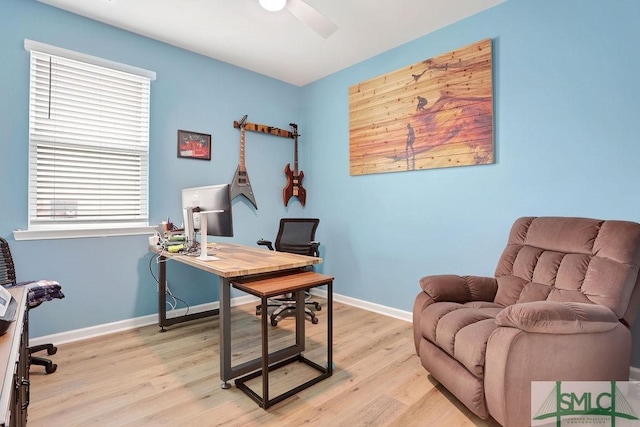 office space featuring light wood-type flooring and ceiling fan