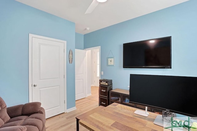 office area with light hardwood / wood-style floors and ceiling fan