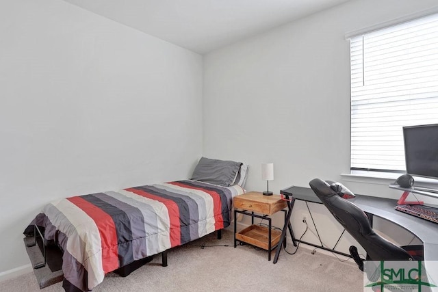 bedroom featuring light colored carpet and multiple windows