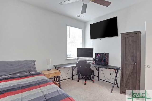 carpeted bedroom with ceiling fan