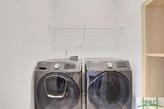 laundry area with separate washer and dryer