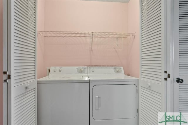 washroom with washer and clothes dryer