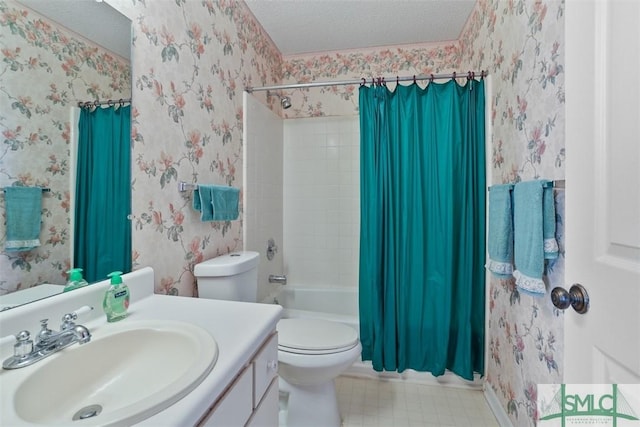 full bathroom featuring vanity, toilet, a textured ceiling, and shower / bath combo with shower curtain