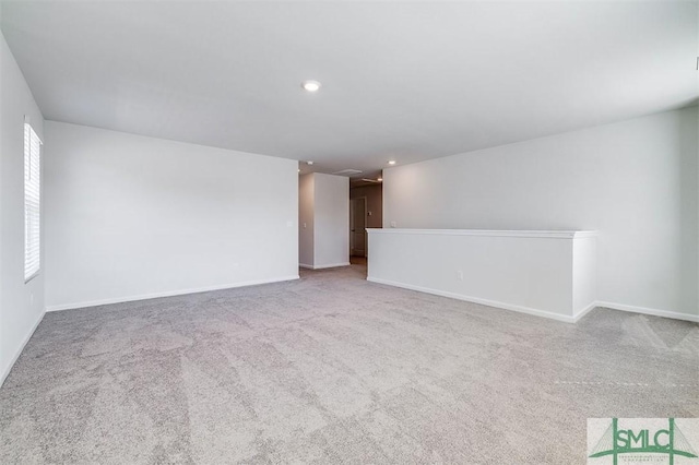 spare room with light colored carpet