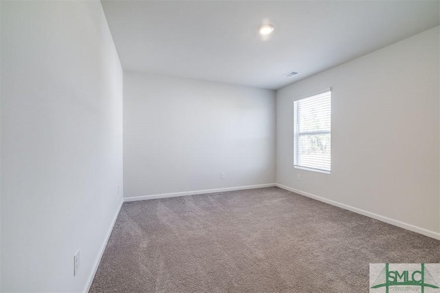 unfurnished room featuring carpet flooring