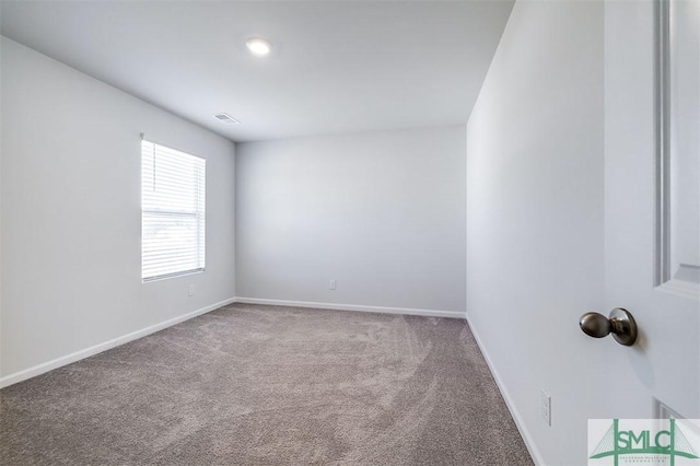 view of carpeted spare room