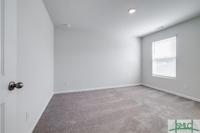 empty room with carpet flooring