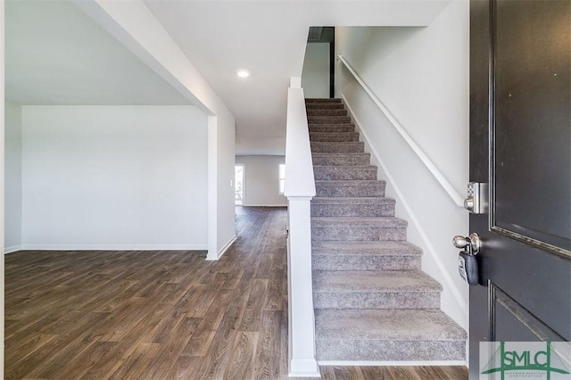 stairway featuring hardwood / wood-style floors