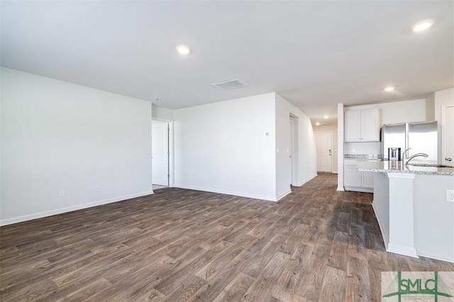 interior space with dark hardwood / wood-style floors